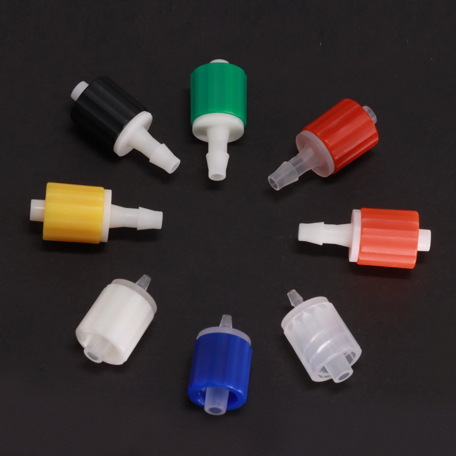 Male Luer assembly examples with white and translucent cores and colored locking collars