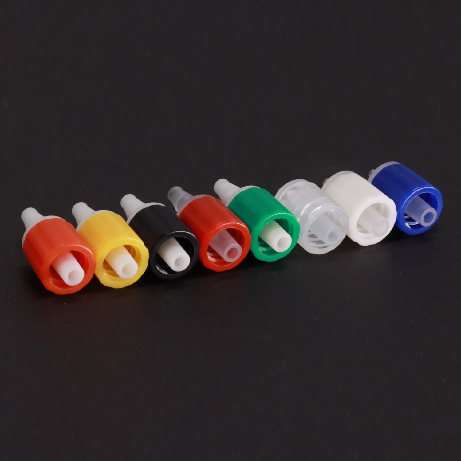 Male Luer assembly examples with colored locking collars, Luer port view